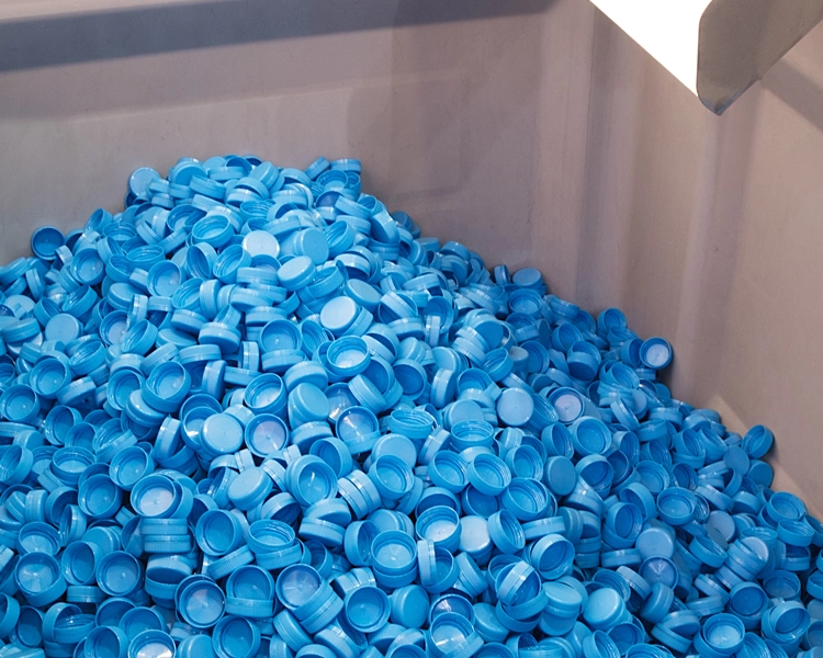 Applications – Food, Beverage and Packaging – Plastic Cap Transport Equipment
